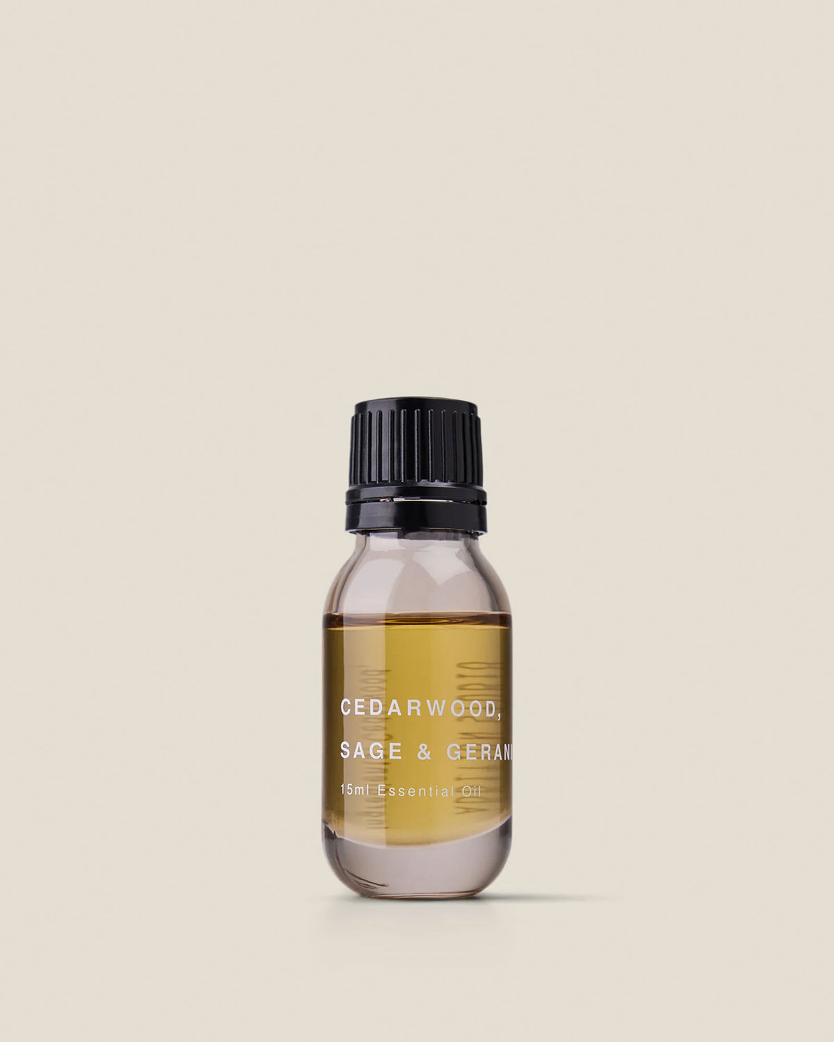 A small clear glass bottle with black screw cap of Addition Studio&