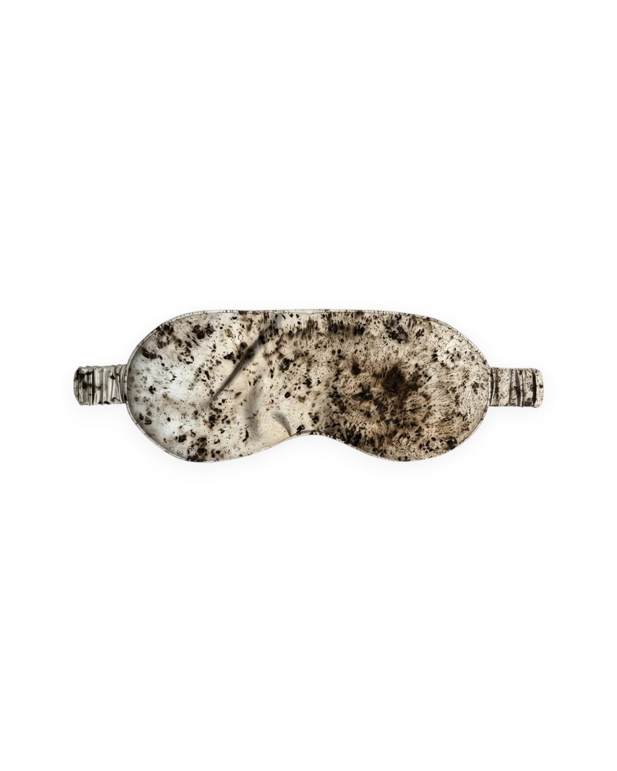A silk eye mask with a marbled pattern in cream, beige, and dark brown, shown against a plain white background.