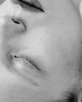 Close-up black and white photograph of a person&