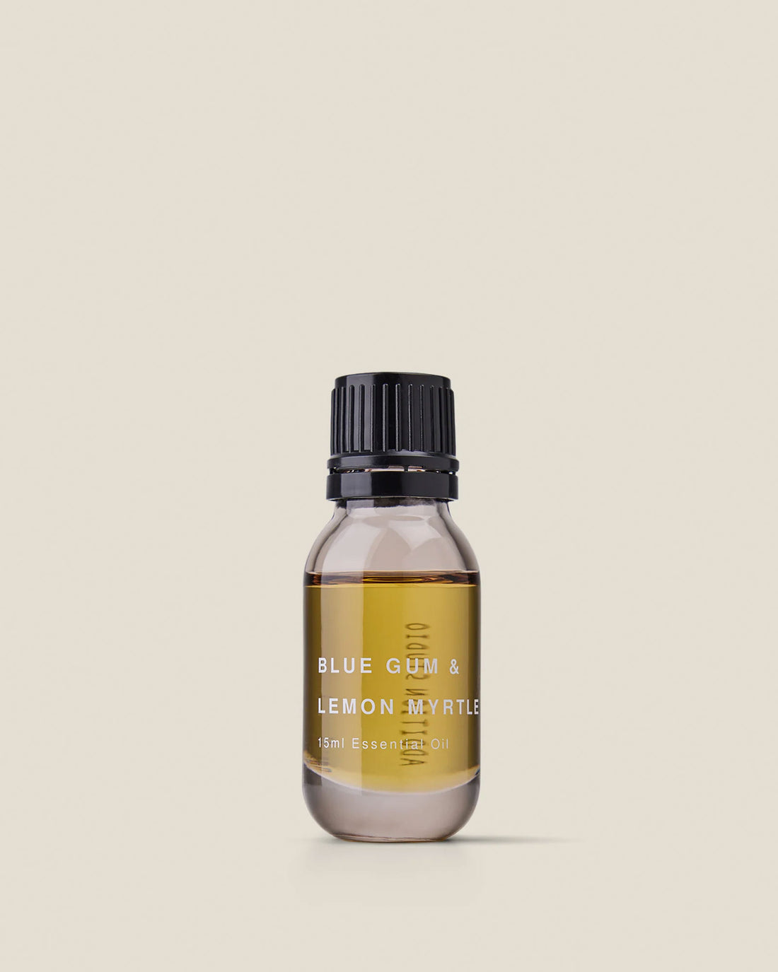 A small clear glass bottle with black screw cap of Addition Studio&