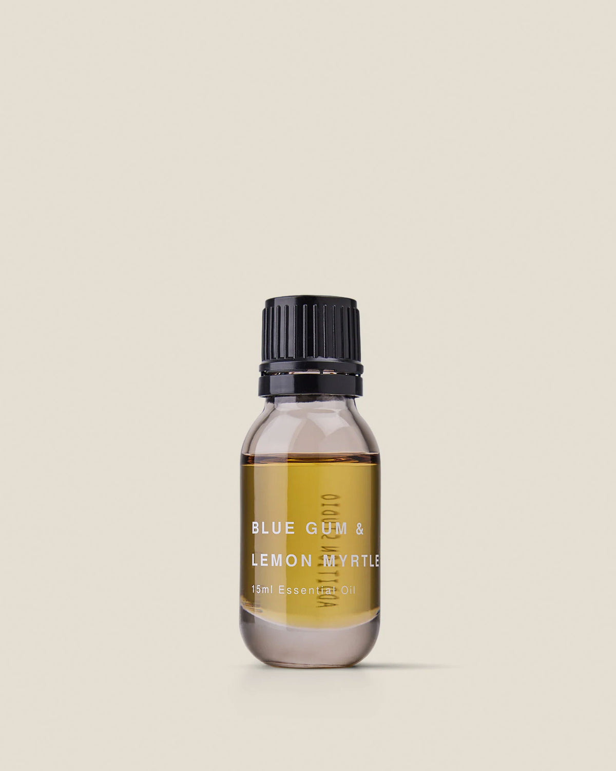 A small clear glass bottle with black screw cap of Addition Studio&