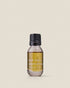 A small clear glass bottle with black screw cap of Addition Studio&