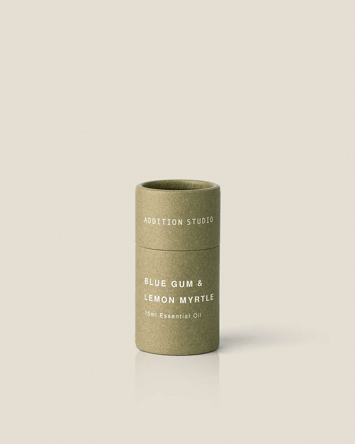 A small olive green coloured cardboard canister product package of Addition Studio&