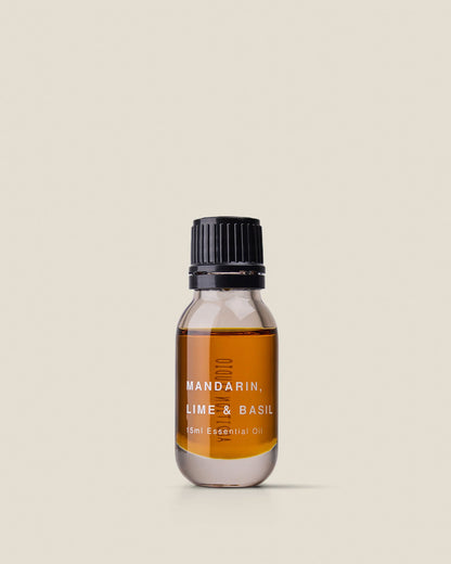 A small clear glass bottle with black screw cap of Addition Studio&