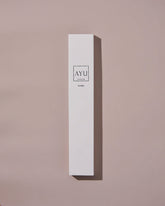 A tall, white box of AYU&