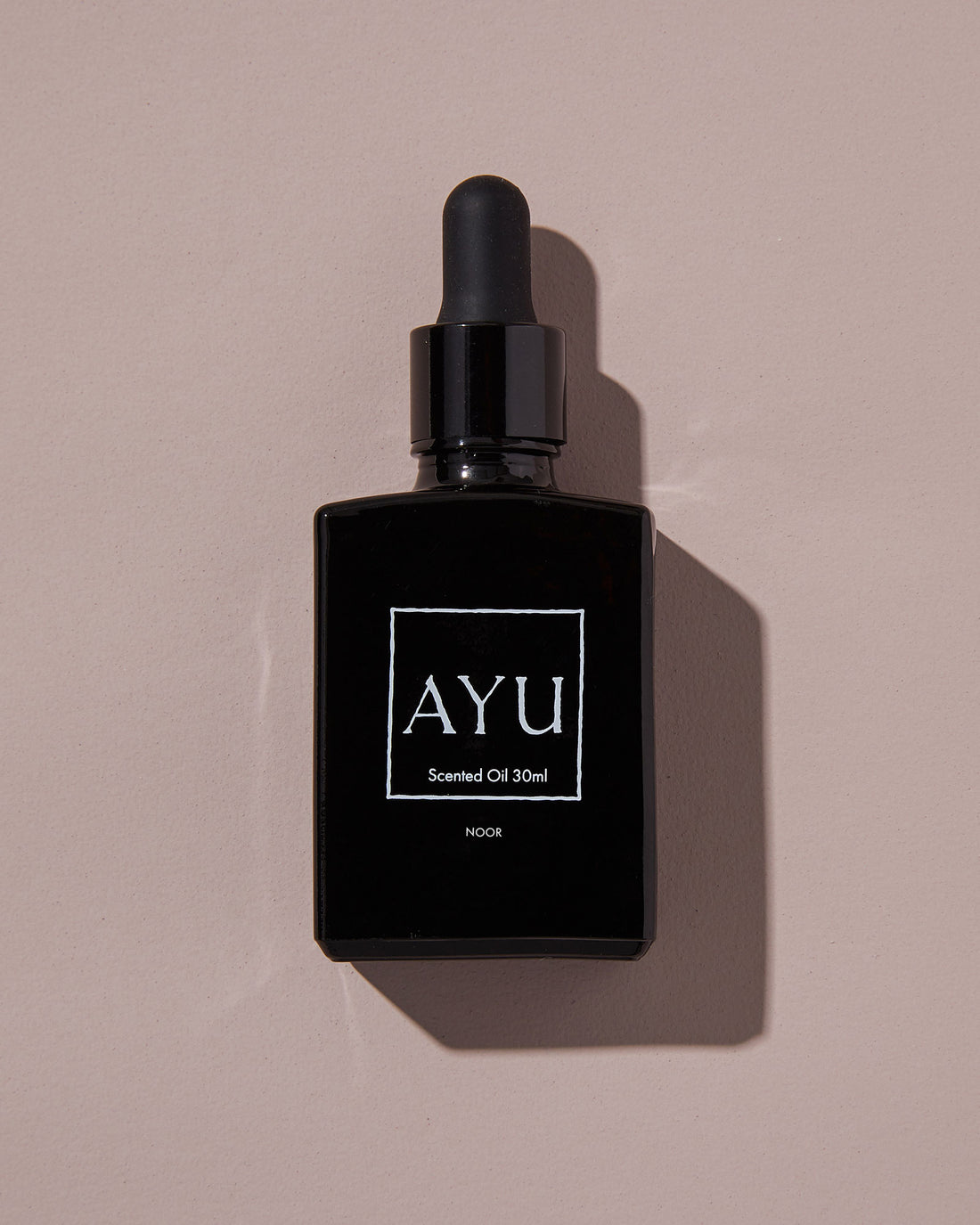 A black bottle of AYU&