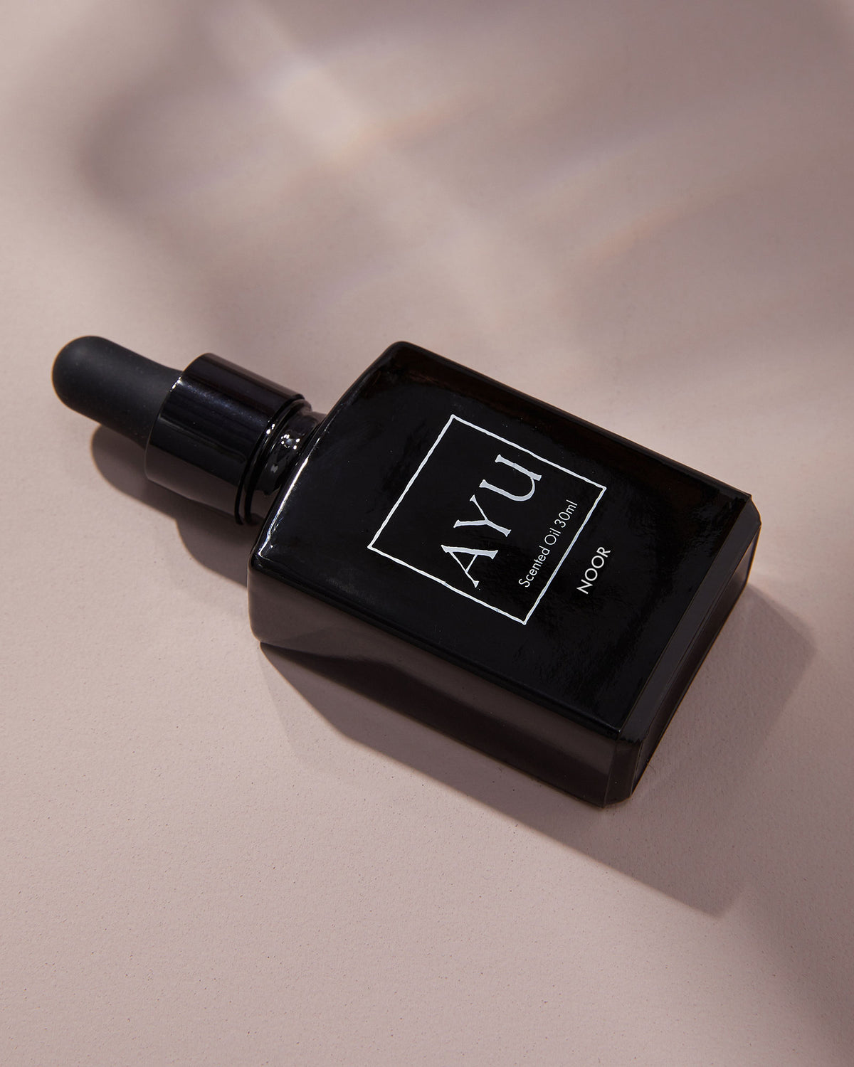 A black bottle of AYU&