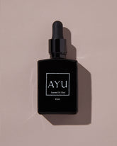 A black bottle of AYU&