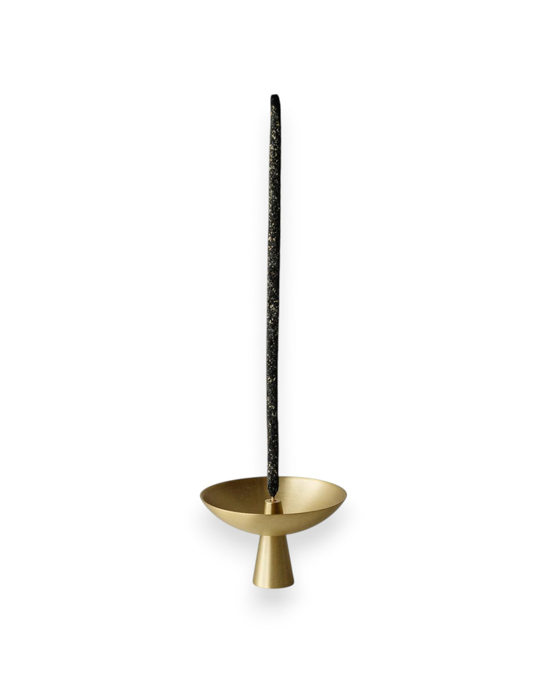 Small brass satellite shaped incense holder with a tall black incense stick standing straight up from the centre. Set against solid white background. 