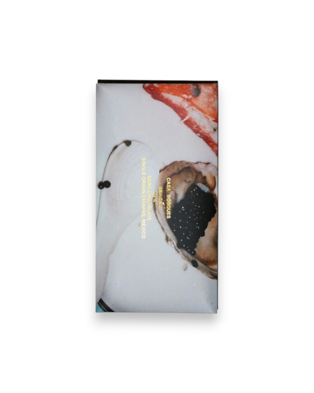 A rectangular packaged bar of Casa Bosques chocolate against a solid white background, label reads "CASA BOSQUES SEA SALT 74%" The graphic on packaging is a full bleed photo of a plate with caviar and lobster claw.