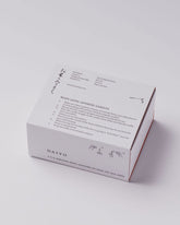 A white product box with Japanese characters and candle burning instructions printed in black ink.