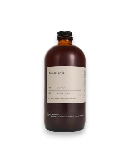 An amber glass bottle of Dona&
