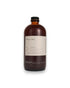 An amber glass bottle of Dona&