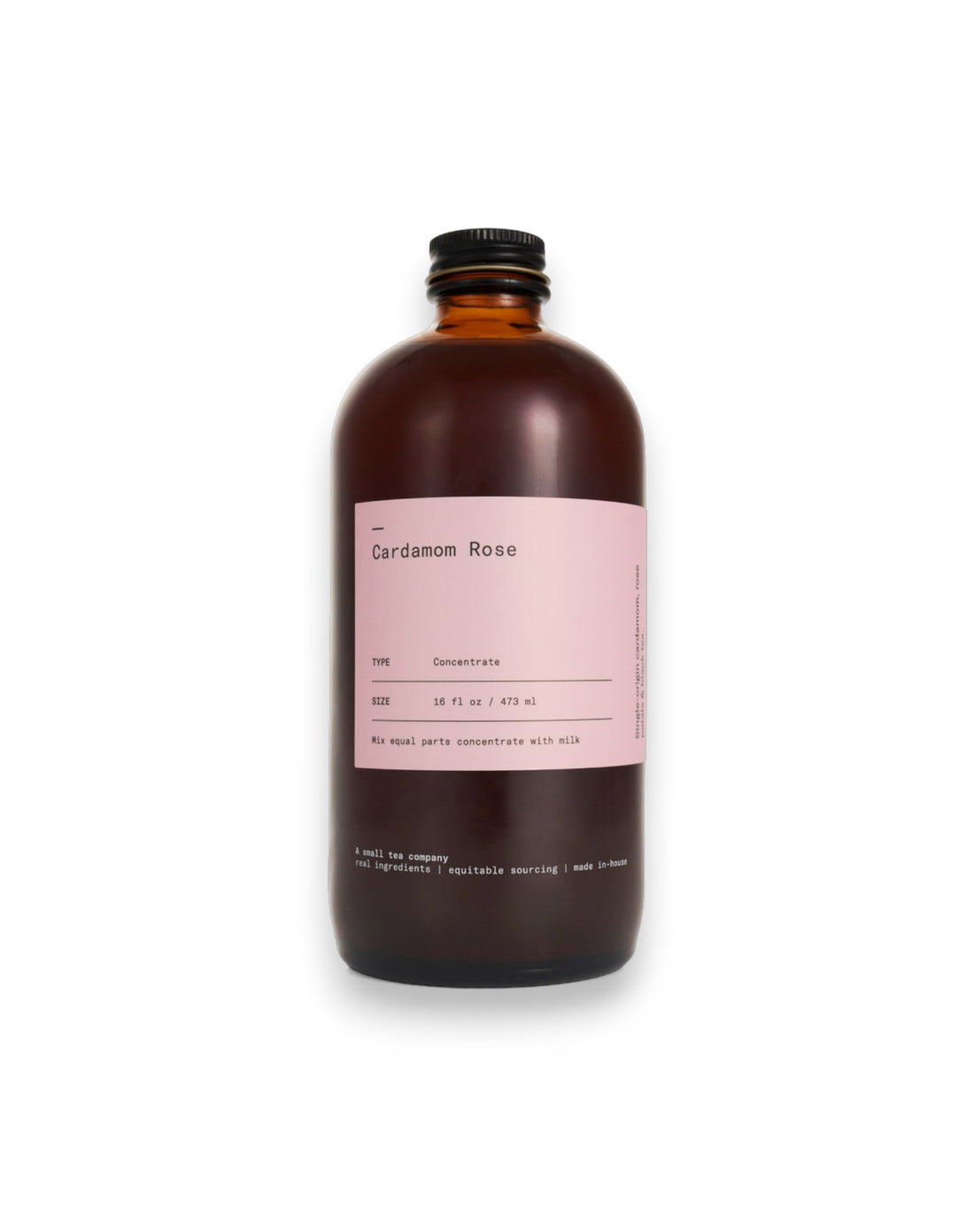 An amber glass bottle labelled Cardamom Rose on white background.
