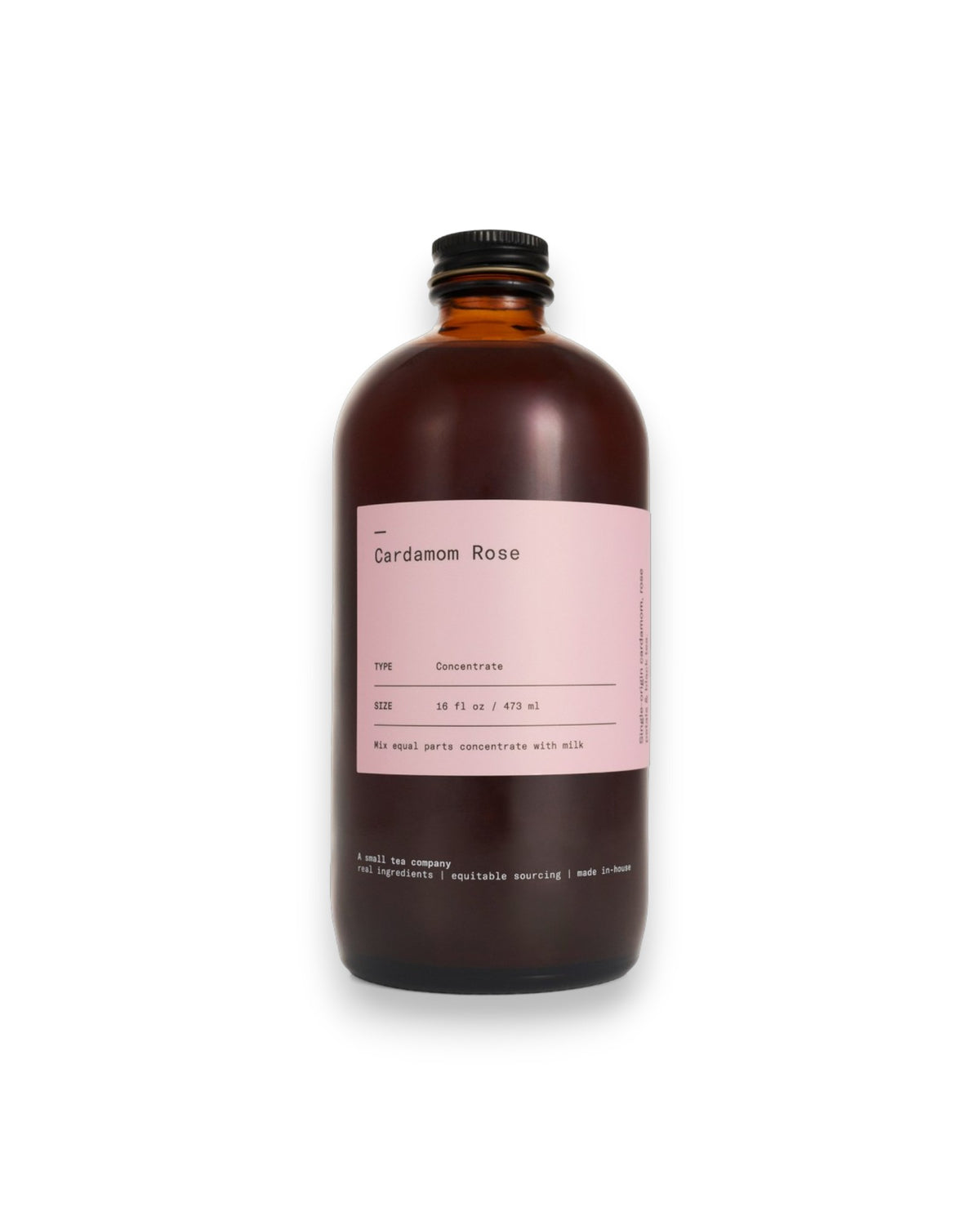 An amber glass bottle labelled Cardamom Rose on white background.