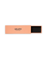 A peach-colored rectangular box of GELATO Incense, partially open to reveal black incense sticks inside, set against a plain white background.