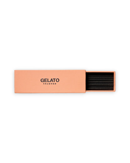 A peach-colored rectangular box of GELATO Incense, partially open to reveal black incense sticks inside, set against a plain white background.
