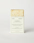 Herb Remedy Calendula botanical soap bar in a white paper sleeve packaging, showing the textured off-white soap bar with small specks at the top, on a clean white background.