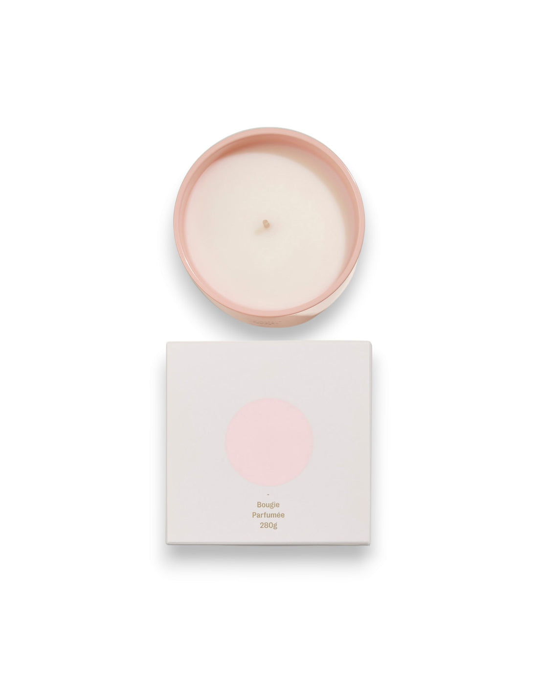 Birdseye view of a round unlit candle next to its square box that features a white lid with a baby-pink coloured circle corresponding to the same colour of the candle container. The box reads Bougie Perfumee 280g, set on an all white background.