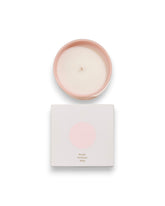 Birdseye view of a round unlit candle next to its square box that features a white lid with a baby-pink coloured circle corresponding to the same colour of the candle container. The box reads Bougie Perfumee 280g, set on an all white background.