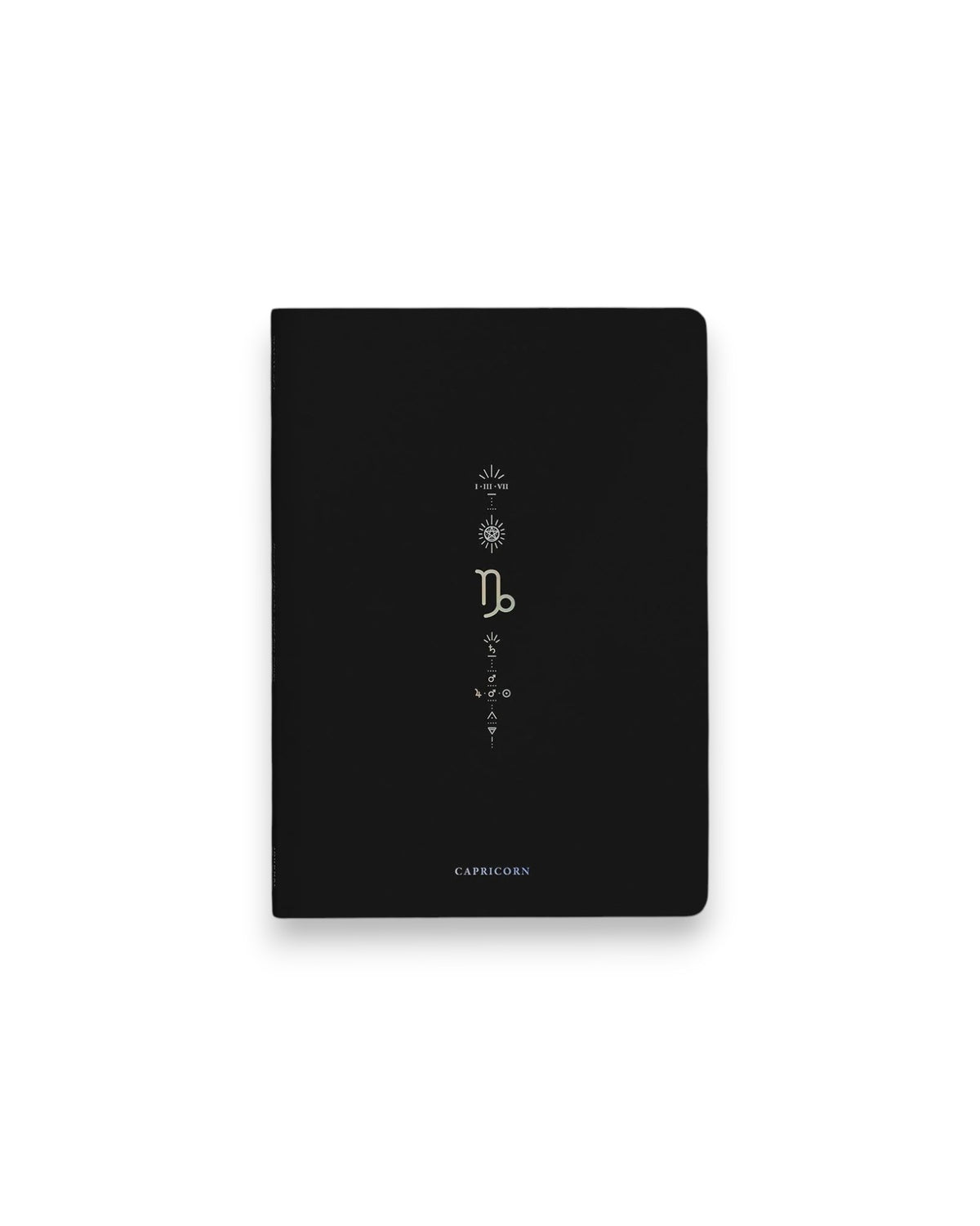 A black hardcover notebook featuring the Capricorn zodiac sign and its chart symbols printed in metallic on the front cover, set against a clean white background.
