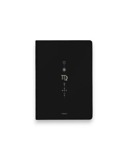 A black hardcover notebook featuring the Virgo zodiac sign and its chart symbols printed in metallic on the front cover, set against a clean white background.