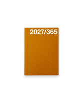 A rectangular A6 orange planner cover with the white text &