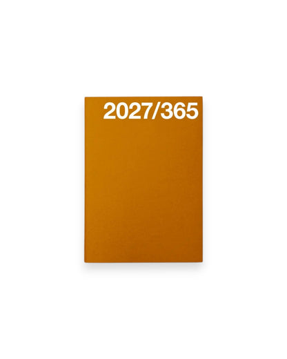 A rectangular A6 orange planner cover with the white text &