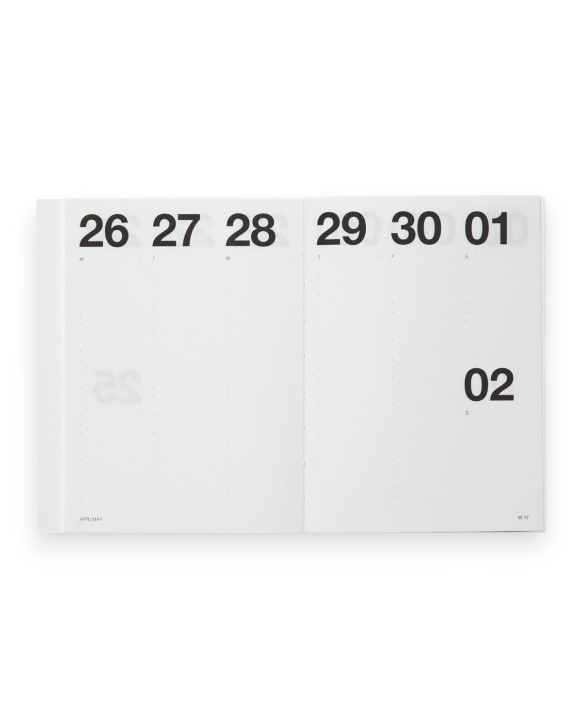 A white paper calendar page spread open, showing the days of the week with black printed numbers. The page is photographed against a clean white background.