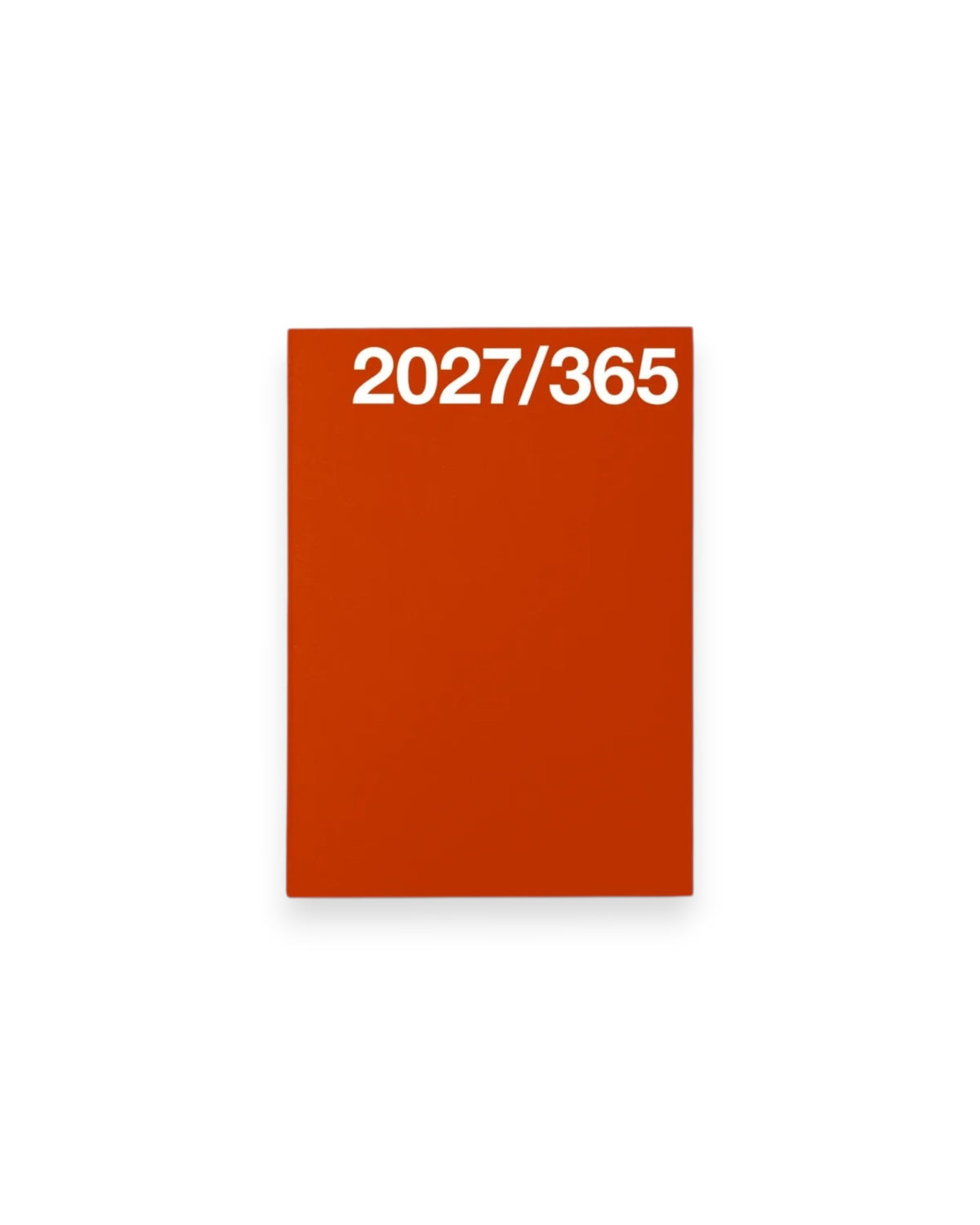 A rectangular A6 red planner cover with the white text &