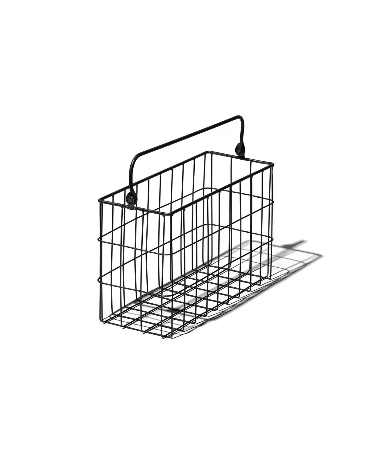 A black rectangular wire basket with handle set on a white background. 