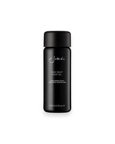 A black cylindrical glass bottle of Sodashi&