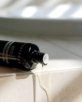 A black bottle of Sodashi&