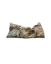 A rectangular weighted eye pillow in beige with dark brown abstract speckled patterns, shown on a plain white background.