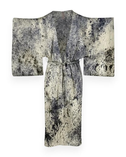 A purple and cream abstract coloured long silk kimono style robe against white background.
