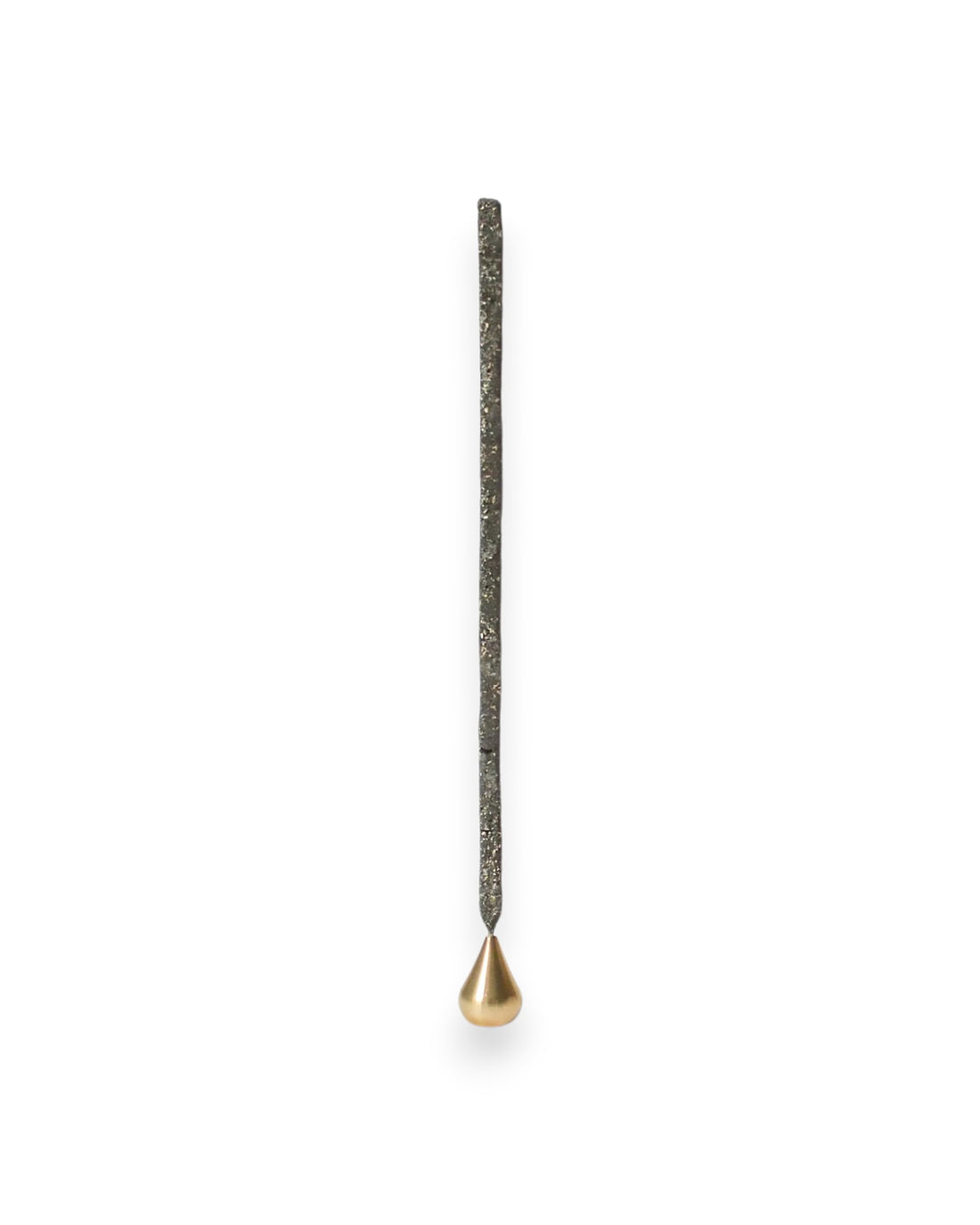 A small teardrop shaped brass incense holder holding a tall incense stick on a solid white background. 