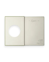 The inside cover spread of a Wilde House Paper moss-coloured, hardcover journal, photographed on a solid white background. 
