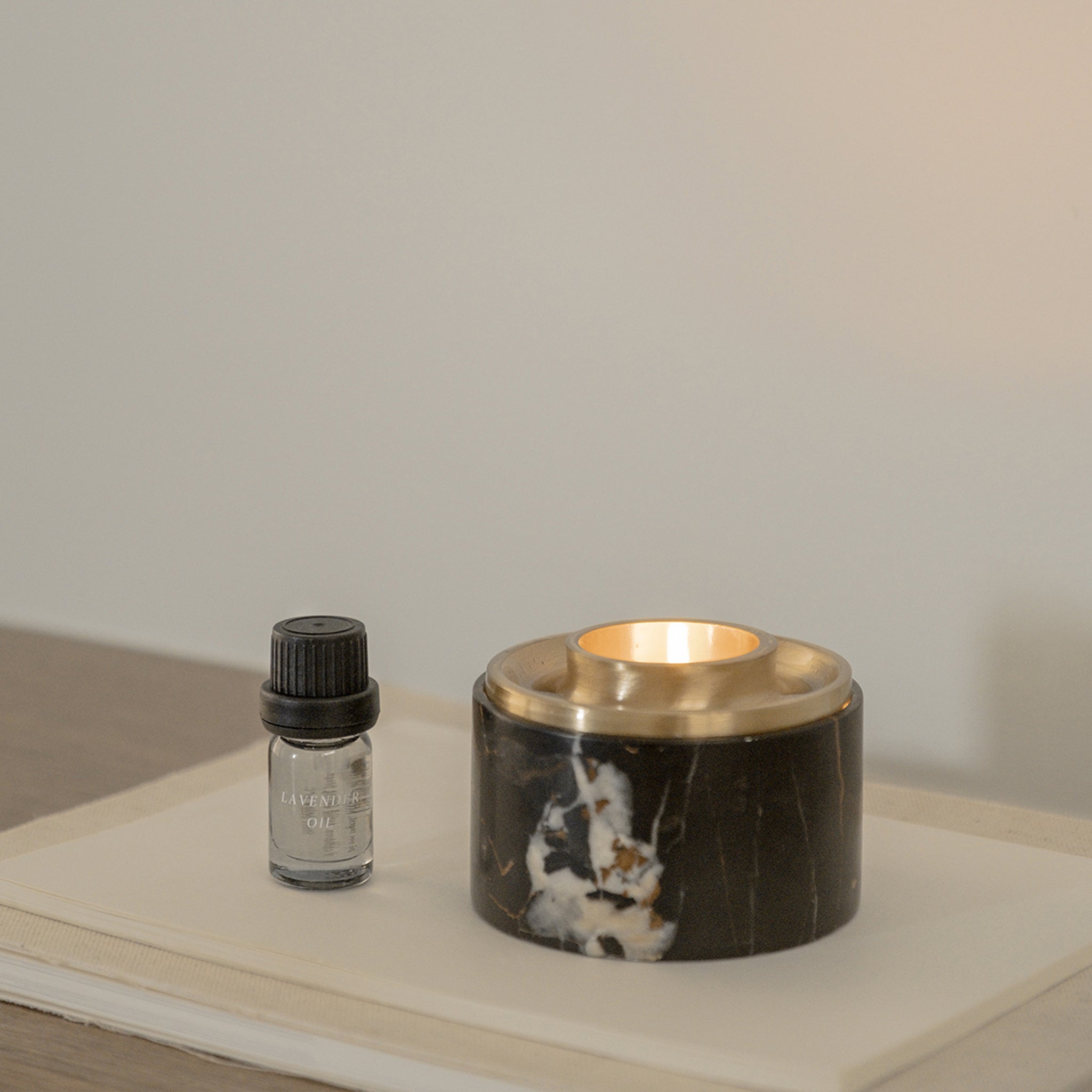 ASTEROID OIL BURNER IN BLACK MARBLE BY ADDITION STUDIO